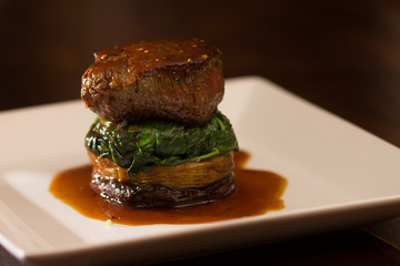 filet mignon steak on spinach