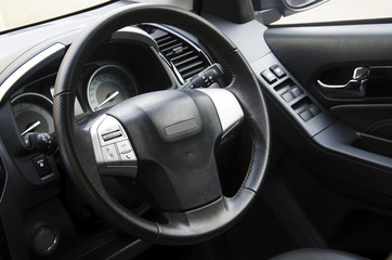 Obraz na płótnie Canvas Car steering wheel in the car console.