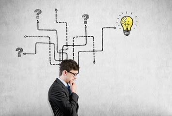 Side view of a man near arrow maze on concrete