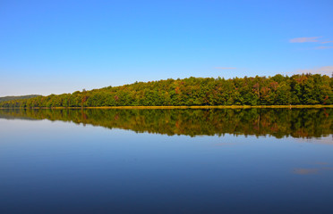 Autumn reflections in Adirondack Park lake.