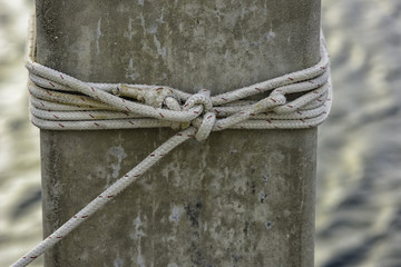 mooring rope tied off to concret piling