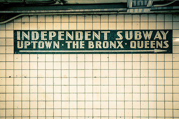 Retro tiled wall in New York City subway station with vintage filter effect - obrazy, fototapety, plakaty