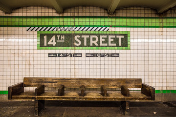 Bench at New York City subway station with vintage tile wall - 132550835