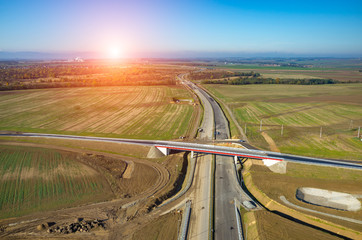 Fototapeta premium Sunset above new road construction site