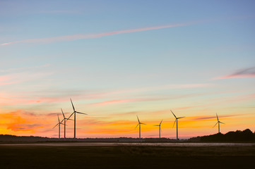Fototapeta na wymiar Silhouette of wind turbine on sunset