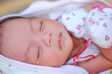 Newborn Asian baby girl sleeping