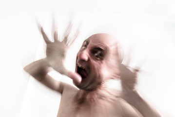 Blurred man suffering from dementia, insanity and schizophrenia, screaming in moment of fury, hallucination and nightmare - obrazy, fototapety, plakaty