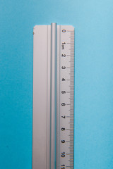 aluminum ruler on blue background