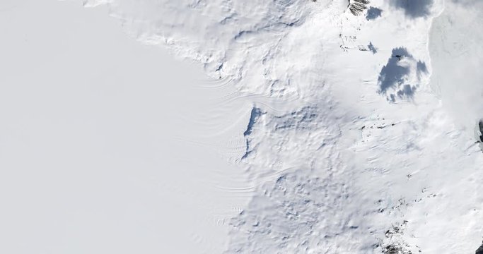 High-altitude overflight aerial of Ross Island on the McMurdo Ice Shelf, Antarctica. Clip loops and is reversible. Elements of this image furnished by USGS/NASA Landsat