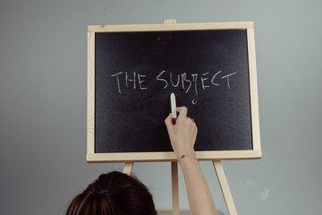 subject written in white chalk on a black chalkboard