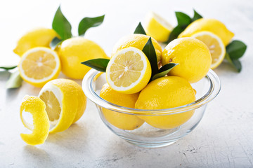 Fresh lemons in a glass bowl