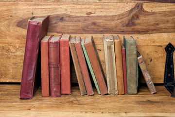  old books on the wooden bookshelfs, vintage