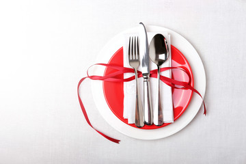Red and white table setting for diner anniversary celebration