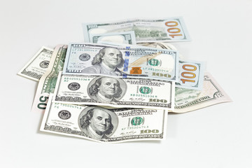 One hundred dollars banknotes on white background