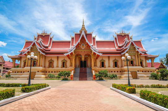 The beautiful temple with blue sky and white cloud in Vientiane, Laos 