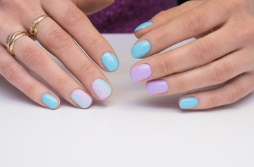 Fototapeta premium Amazing manicure and natural nails with gel polish. Attractive modern nail art design.