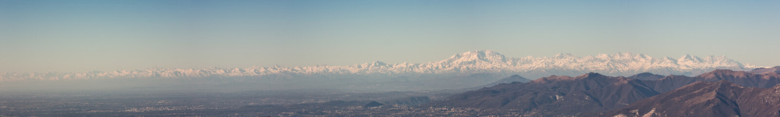 Great landscape with fantastic blue sky on the Orobie Alps and Padana plain a dry winter season without snow. Panorama from Linzone Mountain, Bergamo, Italy. 
