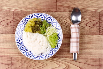 Rice noodle and minced pickle lettuce,cabbage and wing beans.
