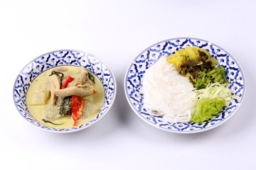 Rice noodle and green chicken curry in coconut milk.