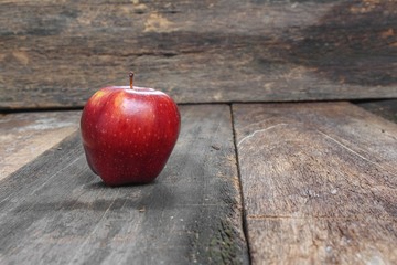 Red Apple Close up, on wooden background and copy space.