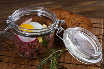 Tartare with quail egg and rye bread