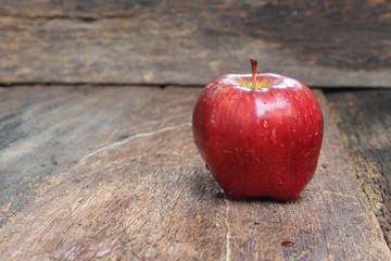 Red Apple Close up, on wooden background and copy space.
