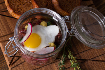 Tartare with quail egg and rye bread