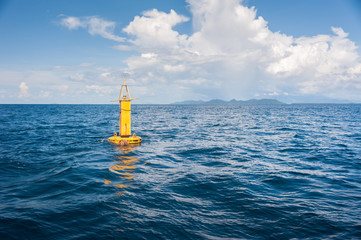 Yellow Sea Buoy in blue Sea at Andaman Sea, Thailand