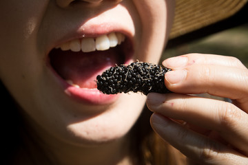 The sour expression, Biting a mulberry