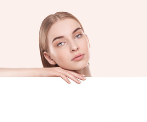 beauty skin female portrait on a table over beige background