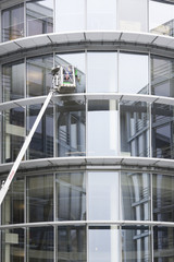 cleaning the windows of a building