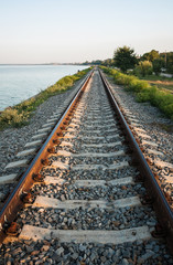 The railway line along the coast of the estuary of the Yeisk, Krasnodar region, Russian Federation