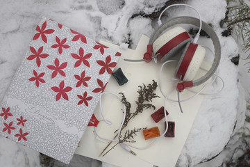 
red headphones, note pad and watercolor
