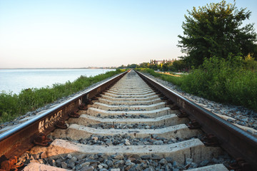 The railway line along the coast of the estuary of the Yeisk, Krasnodar region, Russian Federation