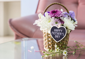 Happy mother's day letter on wood heart and chrysanthemum flower