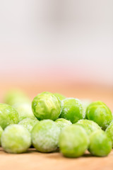 Frozen green peas with blurred background