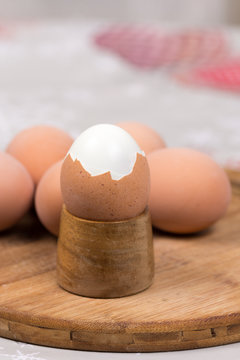 Boiled egg on the wooden holder