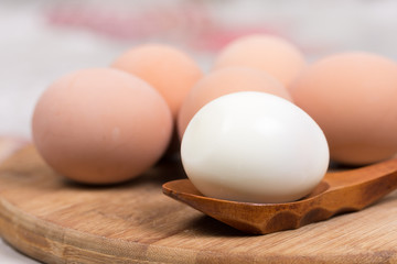 Boiled egg on the wooden holder