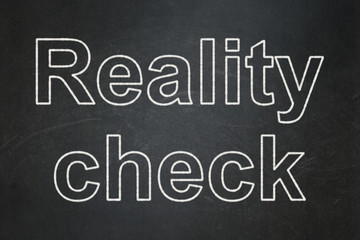 Finance concept: Reality Check on chalkboard background