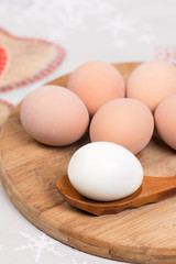 Boiled egg on the wooden holder