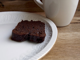 Chocolate cake with a cup