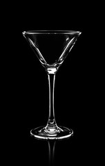 silhouette of empty martini glass isolated on black background,