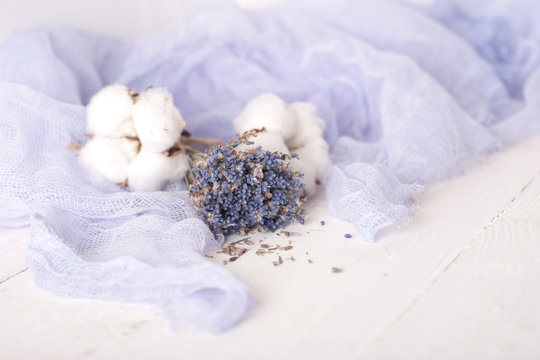 lavender and cotton with violet textile on white wooden table. s