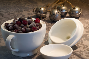 Frozen berries, black currants, in a porcelain dish. macro