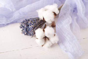 lavender and cotton with violet textile on white wooden table. s