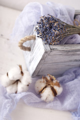 Fototapeta na wymiar lavender and cotton with violet textile on white wooden table. s