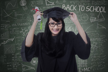 Attractive student celebrate graduation in class