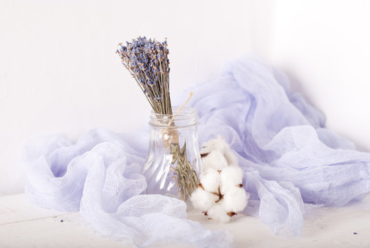 lavender and cotton with violet textile on white wooden table. s