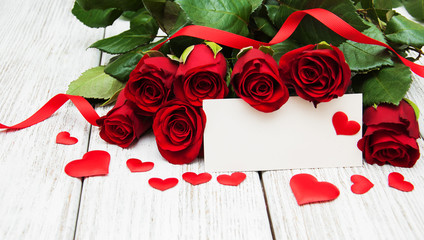 Red roses and greeting card