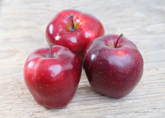 red apples on vintage wooden background